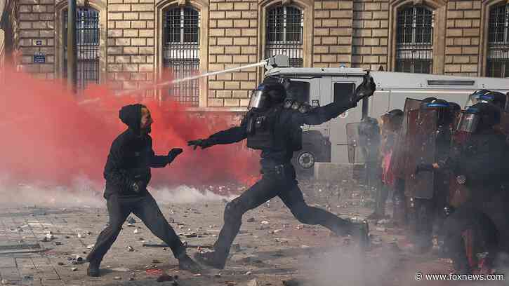 Violence erupts at France protests as Macron warns unrest is being exploited