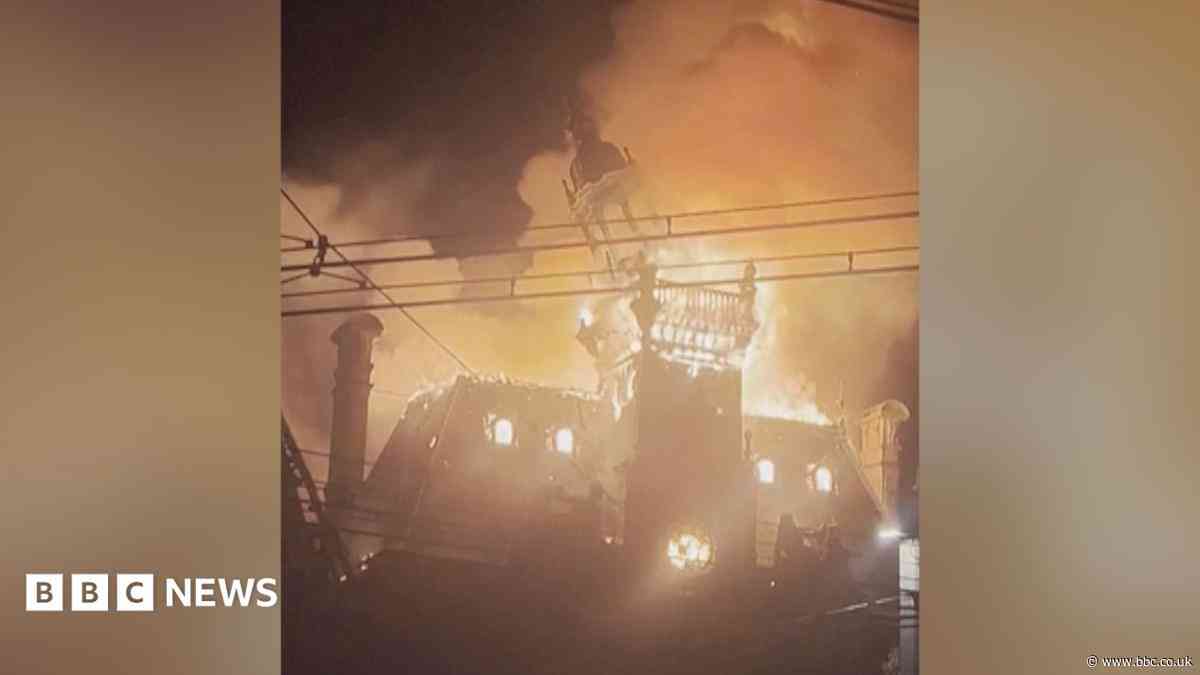 Watch: Moment historic French town hall spire collapses in flames amid protests
