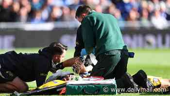 Chelsea star Emiliano Martinez rushed to hospital after sickening head injury during Everton clash - as goalkeeper is BOOED while being taken off on a stretcher