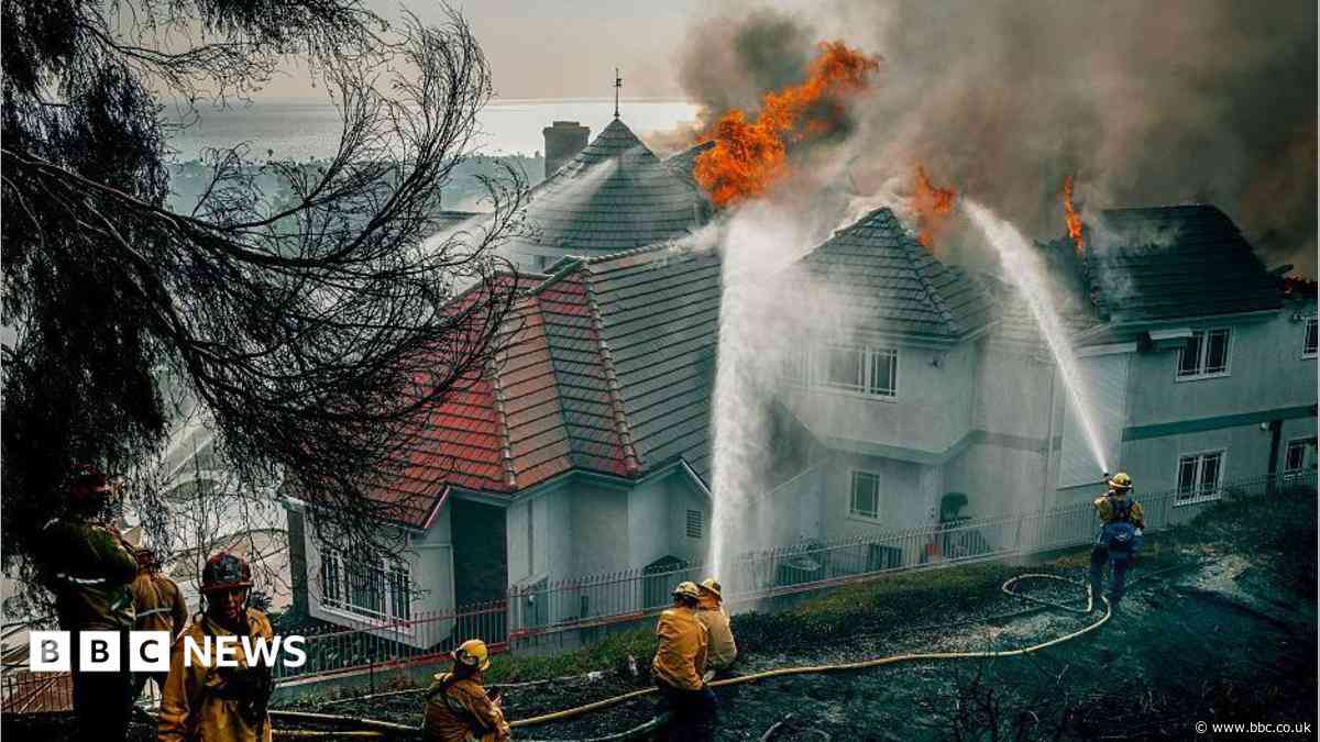 Fast-moving California wildfire burns homes as people are ordered to leave