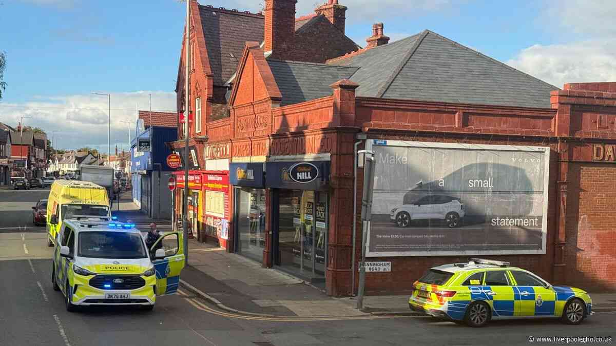 Man arrested after pedestrian hit by car outside row of shops in Anfield
