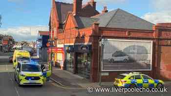Man arrested after pedestrian hit by car outside row of shops in Anfield