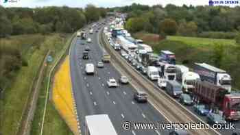 M6 closed in Merseyside after van and lorry crash causes fire