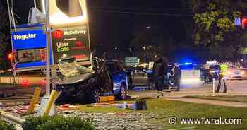 Van crashes into gas station sign after being hit on Capital Boulevard in Raleigh