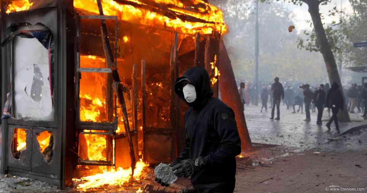 French protests turn violent with looting, torched cars and more