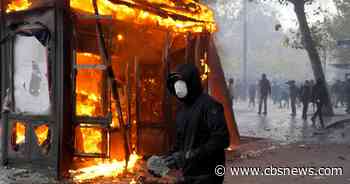 French protests turn violent with looting, torched cars and more