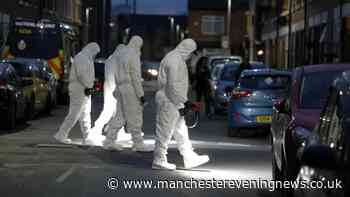 Woman arrested as Moss Side murder probe launched and cordon put in place