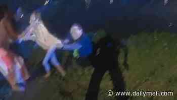 Hero sheriff's deputy filmed jumping into neck-deep pond to rescue non-verbal child who has autism