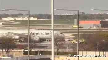 Emergency services swarm American Airlines flight after two tyres blow during landing at busy airport