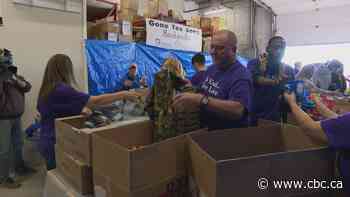 Volunteers prepare 204 gift backpacks for Winnipeggers in need
