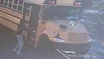 Incredible moment heroic young man rushes into school bus and saves the lives of nearly 20 screaming children