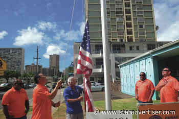 Unions help Club 100 install new flagpole