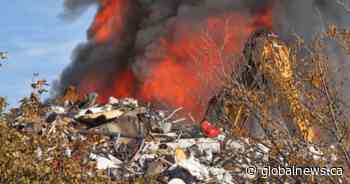 Fire crews respond to massive blaze at scrap metal yard in Kingston