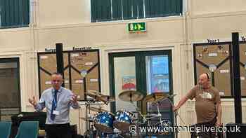 Status Quo drummer Jeff Rich gives pupils at Tyneside primary school a percussion masterclass