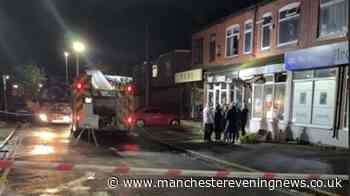 Emergency services cordon off street after fire at fish and chip shop