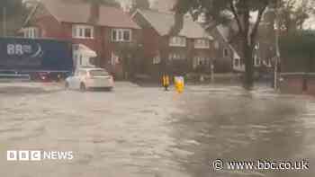 Cars stranded as flash floods hit seaside town