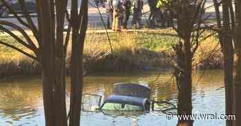 Crews working to pull car from Durham pond near Streets at Southpoint