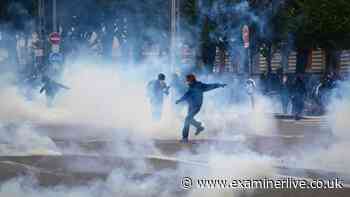 France deploys tear gas and water cannons as thousands march over cost of living