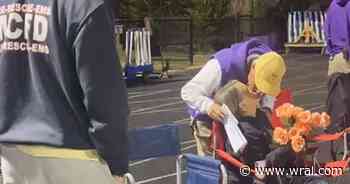 On cam: High school football players surprise Holly Springs coach's wife with roses