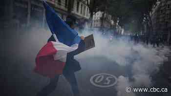 Tens of thousands march in France as protests continue over schools and living costs