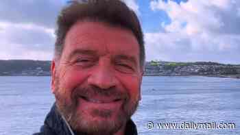 Nick Knowles reveals he's 'clearing his head' and thanks fans for their support as he takes time out on the coast after his show DIY SOS was axed