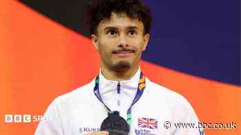Jarman wins historic men's floor silver at worlds
