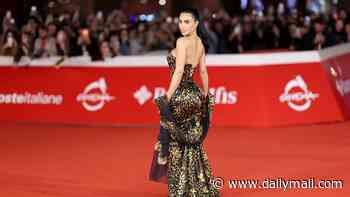 Kim Kardashian turns heads in a couture YSL leopard print dress as she joins All's Fair co-stars Naomi Watts and Sarah Paulson at the series two premiere in Rome
