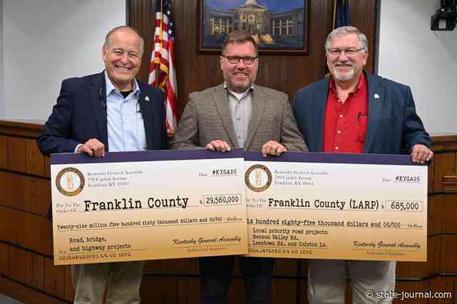 Legislators gift ceremonial checks to fiscal court for road fund aid