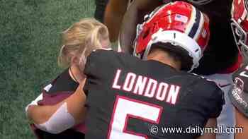 Terrifying moment camerawoman is slammed to the ground by mammoth NFL player scoring a touchdown