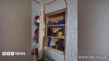Police find illegal cigarettes hidden in shop wall
