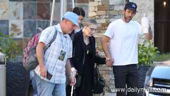 Tatum O'Neal, 62, looks frail as she hobbles with a cane at a fan convention after near-fatal stroke