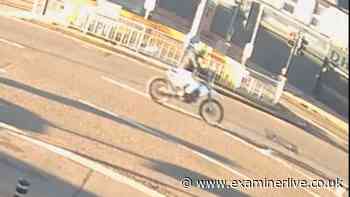 Watch as off-road biker pulls wheelie before smashing into car and fleeing