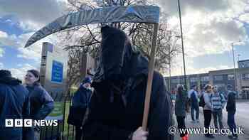 'Funeral march' staged over planned university cuts