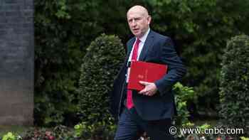 The UK cuts energy bills, taxes banks and boosts defense in high-stakes budget