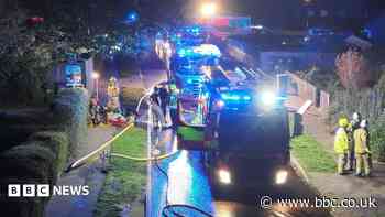 Fire crews tackle house blaze in village