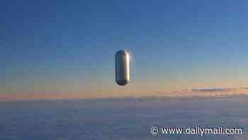 Mysterious pill-shaped UFO caught on camera by pilots flying above Middle America