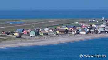 Rising water is forcing this French town off Newfoundland to move. Not everyone is ready to leave
