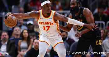 Hawks beat Cavaliers 114-111 to cap busy day at State Farm Arena