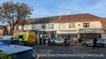 Chaos at Stretford barbers as windows smashed and two arrested